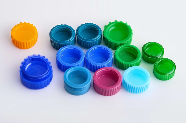 Colorful plastic bottle caps in various sizes